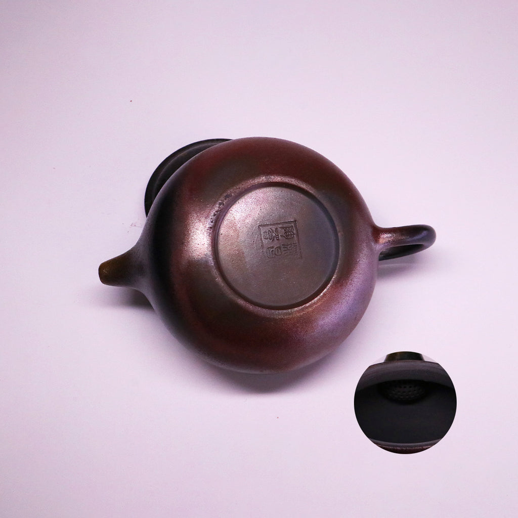 Chinese Handcrafted Fanggu Teapot top view showing handmade ceramic details and signature stamp