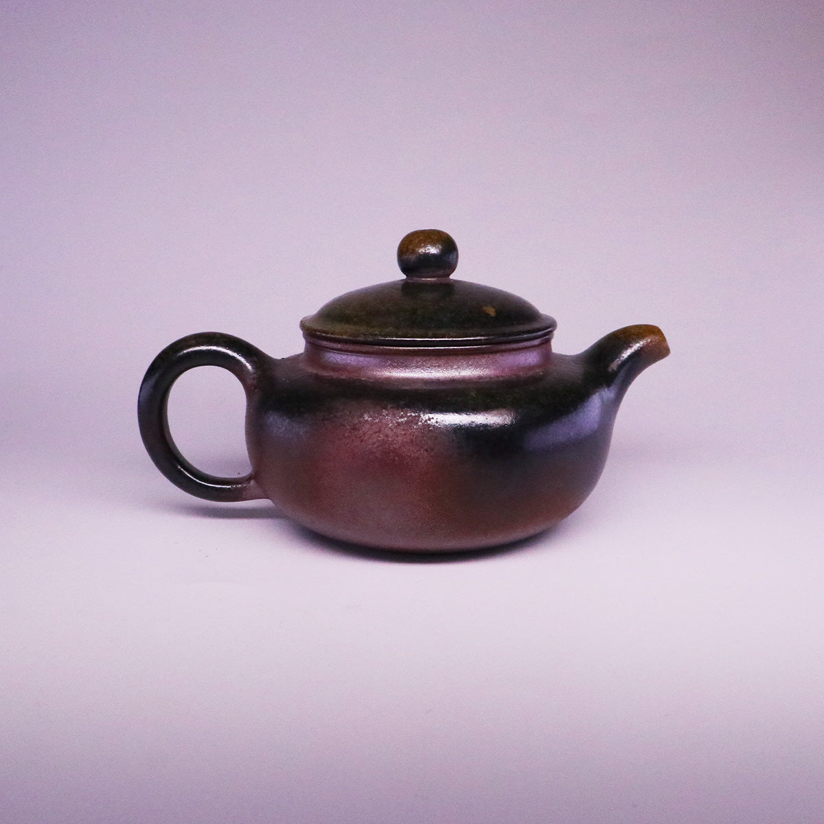 Chinese Handcrafted Fanggu Teapot pure handmade ceramics with rounded body and dark glossy finish