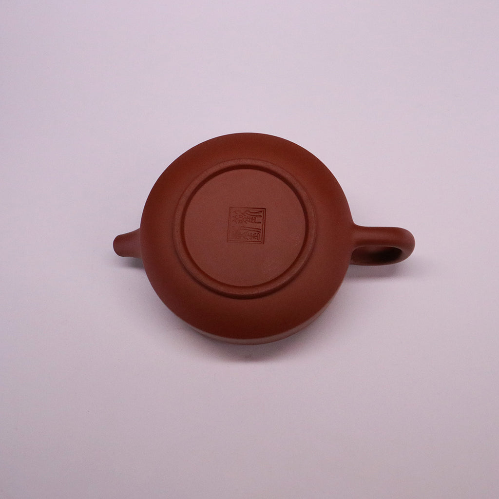 Chinese Rongchang handcrafted teapot in pure handmade ceramics with traditional red clay finish