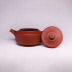 Chinese Rongchang handcrafted teapot made of pure handmade ceramics in reddish-brown color with lid off
