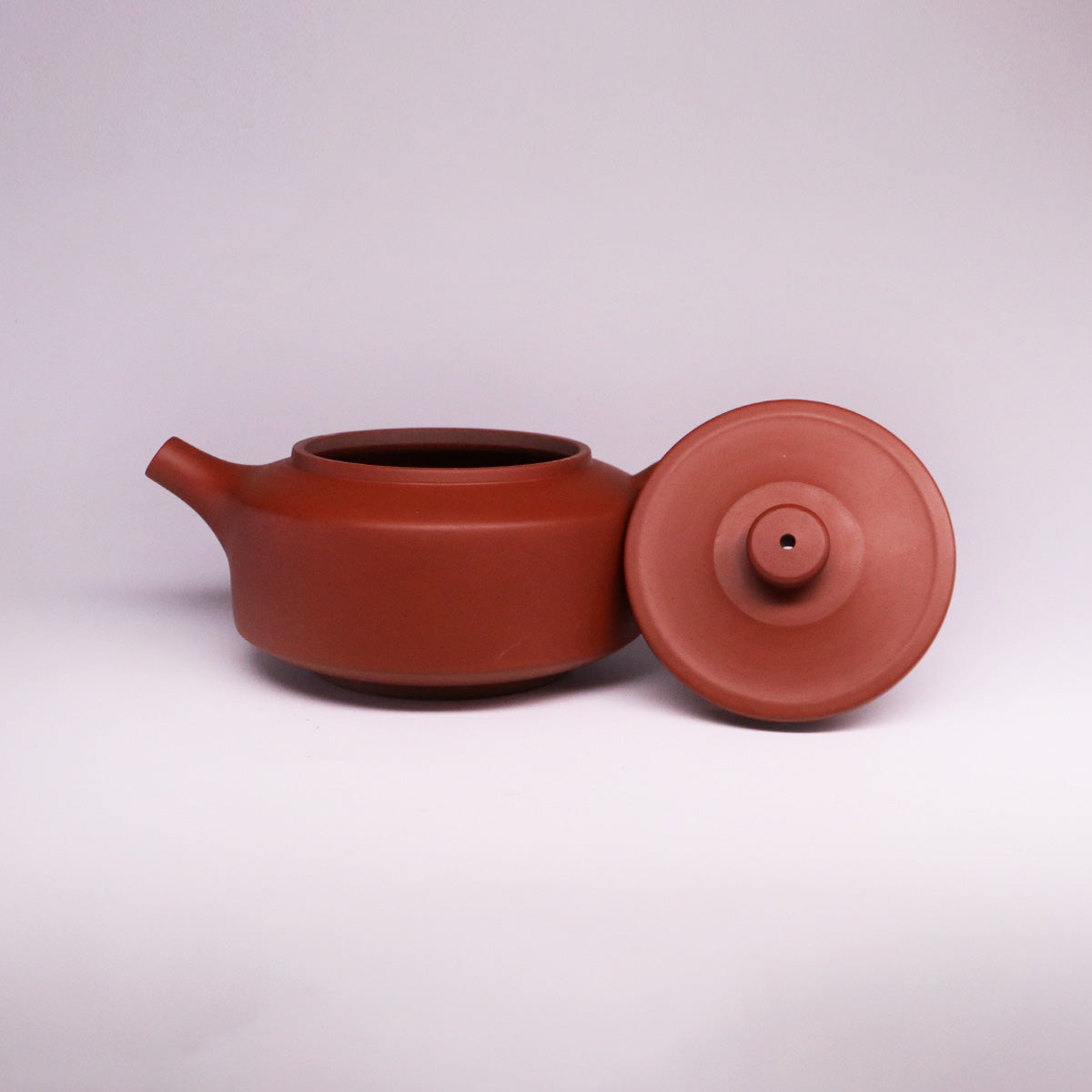 Chinese Rongchang handcrafted teapot made of pure handmade ceramics in reddish-brown color with lid off