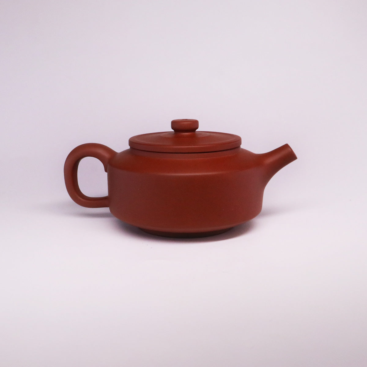 Chinese Rongchang handcrafted teapot in pure handmade ceramics with smooth reddish-brown finish