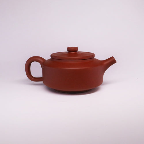 Chinese Rongchang handcrafted teapot in pure handmade ceramics with smooth reddish-brown finish