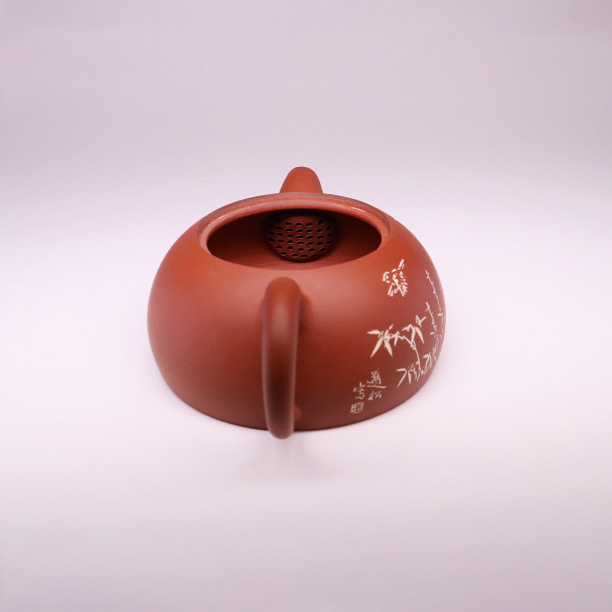 Handcerami handcrafted ceramic teapot in brown with delicate white floral design and curved handle