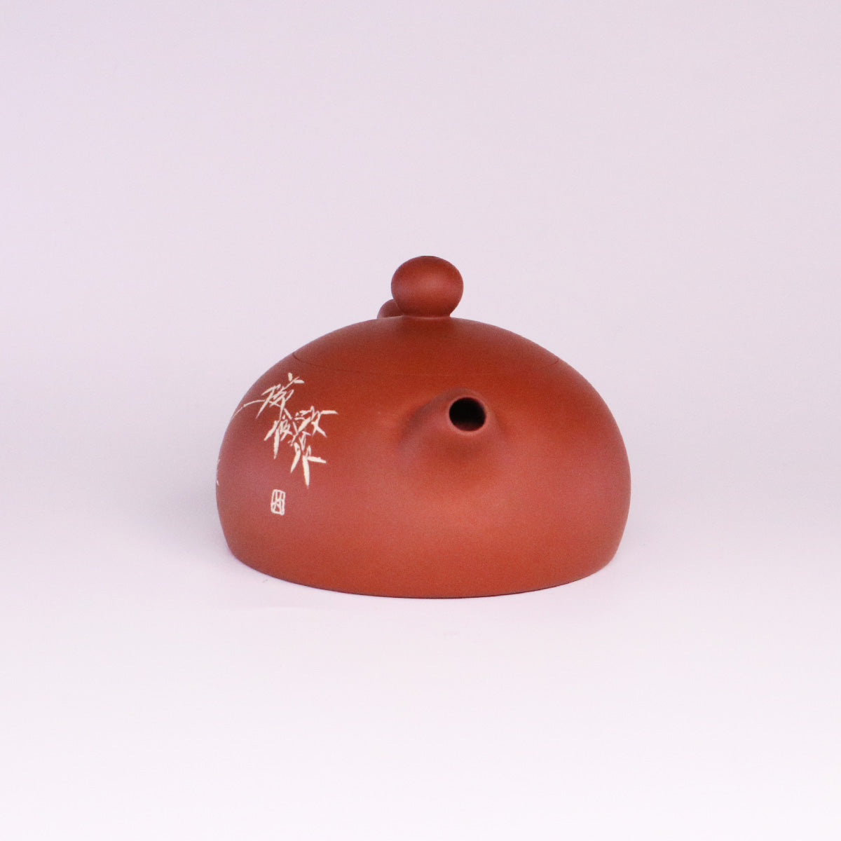 Handcerami handcrafted ceramic teapot with a smooth brown finish and delicate white bamboo design