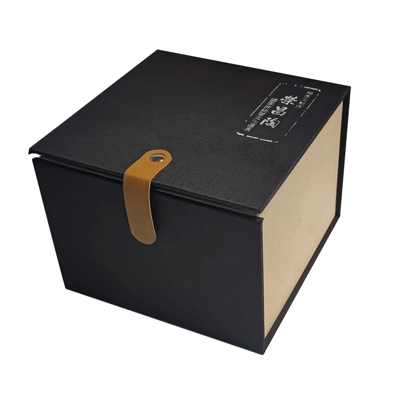 Black and beige gift box with leather strap for handcrafted ceramic teapot packaging